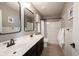 Neutral bathroom with double sink, shower, and framed mirrors at 5824 W Commonview Dr, McCordsville, IN 46055