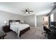 Bedroom with neutral colors, ceiling fan, and en suite bathroom at 5824 W Commonview Dr, McCordsville, IN 46055