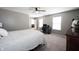 Spacious bedroom featuring a ceiling fan, carpet floors, neutral walls, and natural light at 5824 W Commonview Dr, McCordsville, IN 46055