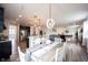 Bright and airy dining area showcases an open layout connecting the kitchen and living spaces at 5824 W Commonview Dr, McCordsville, IN 46055