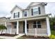 Inviting front porch with decorative railing and brick accents, perfect for relaxing and enjoying the neighborhood at 5824 W Commonview Dr, McCordsville, IN 46055