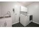 Efficient laundry room featuring a modern washer and dryer set, sink, and ample counter space at 5824 W Commonview Dr, McCordsville, IN 46055
