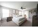 Spacious main bedroom with a cozy ambiance, ceiling fan and ensuite bathroom access at 5824 W Commonview Dr, McCordsville, IN 46055