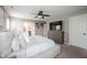 Spacious main bedroom with an ensuite bathroom and TV over a stylish dresser at 5824 W Commonview Dr, McCordsville, IN 46055
