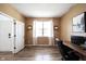 Functional home office with ample natural light, modern desk setup, and a neutral color palette at 5824 W Commonview Dr, McCordsville, IN 46055
