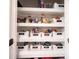 Organized pantry with labeled bins for easy storage and accessibility, filled with various food items at 5824 W Commonview Dr, McCordsville, IN 46055