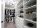 Organized walk-in closet with custom shelving and ample storage space for clothing and accessories at 5824 W Commonview Dr, McCordsville, IN 46055