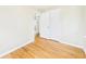 This bedroom features hardwood floors, closet, and an open doorway to the next room at 602 W 34Th St, Anderson, IN 46013