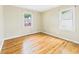 Cozy bedroom with hardwood floors, neutral walls, and abundant natural light at 602 W 34Th St, Anderson, IN 46013