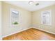 Well-lit bedroom showcasing hardwood floors, neutral walls, and plenty of natural light at 602 W 34Th St, Anderson, IN 46013