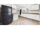 Spacious kitchen featuring white cabinets, linoleum floors, and standard appliances at 602 W 34Th St, Anderson, IN 46013