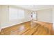 Inviting living room featuring polished hardwood floors and a well-lit, airy atmosphere at 602 W 34Th St, Anderson, IN 46013