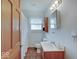 Well-lit bathroom featuring neutral walls, single vanity, and tub/shower combo at 6069 E 15Th St, Indianapolis, IN 46219