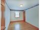 Bedroom with hardwood floors, natural light, and neutral walls with character border at 6069 E 15Th St, Indianapolis, IN 46219