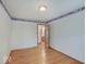 Bedroom with hardwood floors, natural light, and neutral walls with character border at 6069 E 15Th St, Indianapolis, IN 46219
