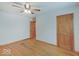 Bedroom with hardwood floors, neutral walls, and wooden doors at 6069 E 15Th St, Indianapolis, IN 46219