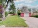 Detached single car garage with a paved driveway, offering convenient parking and storage on a well-maintained lot at 6069 E 15Th St, Indianapolis, IN 46219