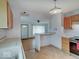 Functional kitchen boasts updated appliances and open floor plan, ideal for entertaining at 6069 E 15Th St, Indianapolis, IN 46219