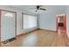 Bright living room features hardwood floors and a view of another room at 6069 E 15Th St, Indianapolis, IN 46219