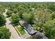 Residential neighborhood with lush greenery, showcasing a house with a driveway and car port at 6143 E 43Rd St, Indianapolis, IN 46226