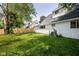 Spacious backyard with healthy lawn and tall wooden fence creates a tranquil outdoor space at 6143 E 43Rd St, Indianapolis, IN 46226