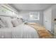 Bright bedroom featuring natural light, large bed, and modern windows at 6143 E 43Rd St, Indianapolis, IN 46226