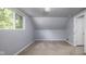 Carpeted bedroom features a dormer window and light-colored walls creating a cozy space at 6143 E 43Rd St, Indianapolis, IN 46226