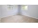 Neutral bedroom with carpet, windows, and light-colored walls creating a serene space at 6143 E 43Rd St, Indianapolis, IN 46226