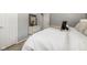 Comfortable bedroom with white bedding and neutral decor at 6143 E 43Rd St, Indianapolis, IN 46226