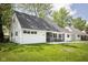 Inviting Cape Cod home with well-kept lawn and quaint front seating, perfect for enjoying the outdoors at 6143 E 43Rd St, Indianapolis, IN 46226
