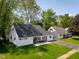 Charming single Gathering home with manicured front lawn and welcoming front porch at 6143 E 43Rd St, Indianapolis, IN 46226