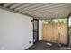 Covered porch offers protection from the elements with a fenced area on the right at 6143 E 43Rd St, Indianapolis, IN 46226