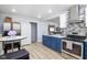 Spacious kitchen with stainless refrigerator, ample storage, and modern finishes at 6143 E 43Rd St, Indianapolis, IN 46226