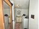 Functional bathroom with a combined washer and dryer, shower, and vanity at 620 W Central Ave, Greensburg, IN 47240