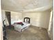 Bedroom featuring neutral carpet, natural light, and closet access at 620 W Central Ave, Greensburg, IN 47240