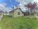 Street view of a quaint one-story home with green lawn and carport at 620 W Central Ave, Greensburg, IN 47240