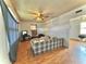 Comfortable living room featuring wood-look floors and a ceiling fan at 620 W Central Ave, Greensburg, IN 47240