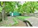 Spacious backyard with a detached garage, wooden deck, and plenty of room for outdoor activities at 631 Prospect St, Indianapolis, IN 46203