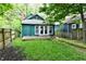 Lush backyard featuring a cozy wooden deck and a well-maintained lawn at 631 Prospect St, Indianapolis, IN 46203