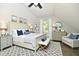Beautiful bedroom with nautical themed decor, an accent rug, natural light, and a ceiling fan at 631 Prospect St, Indianapolis, IN 46203