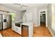 Modern kitchen with stainless steel appliances, center island, and hardwood floors at 631 Prospect St, Indianapolis, IN 46203