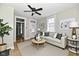 Cozy living room with ceiling fan, natural light, and contemporary furnishings including a sofa and a round table at 631 Prospect St, Indianapolis, IN 46203