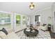Inviting living room featuring hardwood floors, French doors, and a stylish decor at 631 Prospect St, Indianapolis, IN 46203