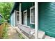 Inviting porch with a charming swing, perfect for relaxing and enjoying the outdoors at 631 Prospect St, Indianapolis, IN 46203