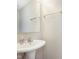 Bathroom with pedestal sink, chrome faucet, and mounted towel rack at 6410 Avacado Dr, Indianapolis, IN 46217