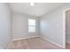 Bedroom featuring a window with blinds and carpet flooring at 6410 Avacado Dr, Indianapolis, IN 46217