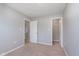 Bedroom with multiple doors and carpet flooring at 6410 Avacado Dr, Indianapolis, IN 46217
