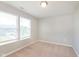 Bedroom with carpet and two windows letting in natural light at 6410 Avacado Dr, Indianapolis, IN 46217