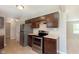 Kitchen featuring stainless steel appliances, brown cabinets, and neutral countertops at 6410 Avacado Dr, Indianapolis, IN 46217