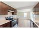 A kitchen featuring brown cabinets and stainless steel appliances at 6410 Avacado Dr, Indianapolis, IN 46217